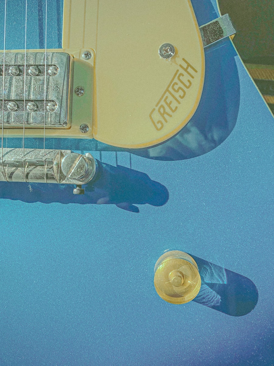A close-up view of a blue gretsch guitar.
